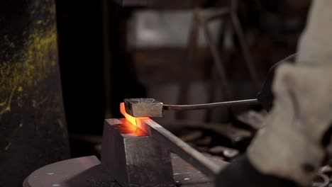 blacksmith working with hot metal