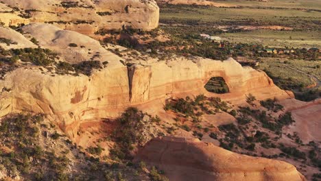 aerial perspective of wilson arch in southeastern utah, usa, showcasing the majestic landscape at sunset