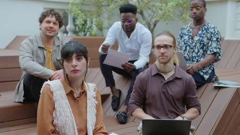 multi-ethnic business team having meeting on outdoor terrace