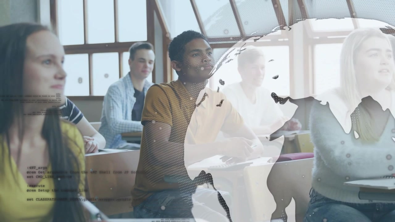 Teenage male sitting at desk, frames advancing, globe sliding across desks, supporting education