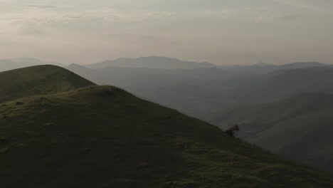 Drone-flying-over-verdant-mountains-of-Iraty,-Biarritz-in-France