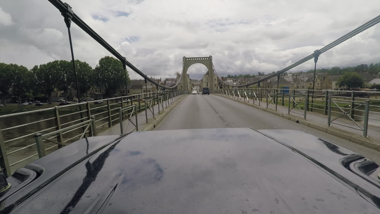 Rear facing view of bridge crossing in french village