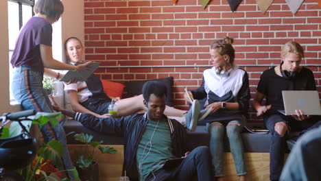 young professionals collaborating in a modern cafe.