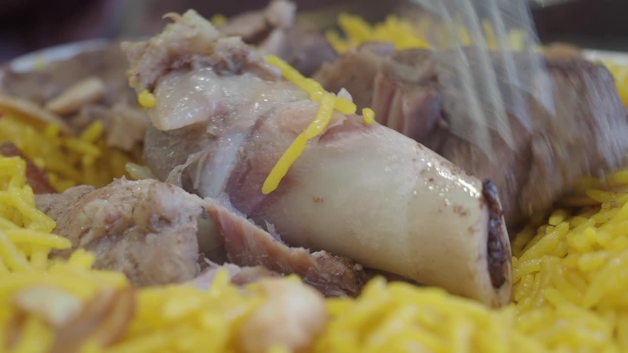 Eating Lamb Ribs with Rice