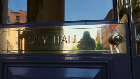 close-up of dublin city hall door with gold plated inscription