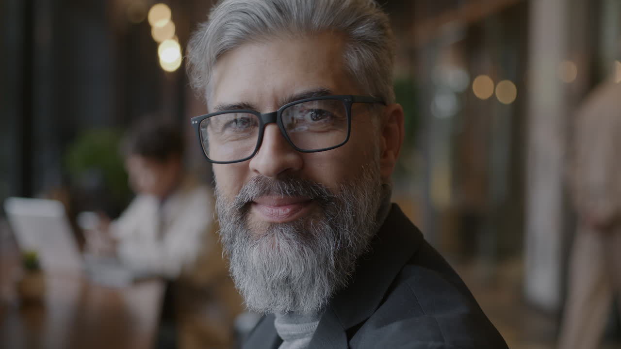 Smiling Business Man in a Cafe