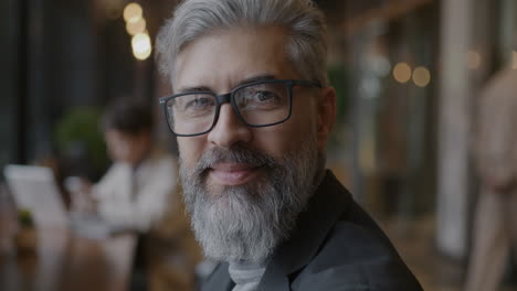 smiling business man in a cafe