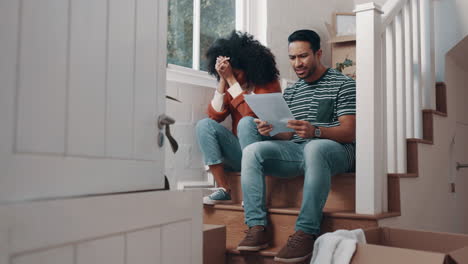 couple in home, angry with paperwork