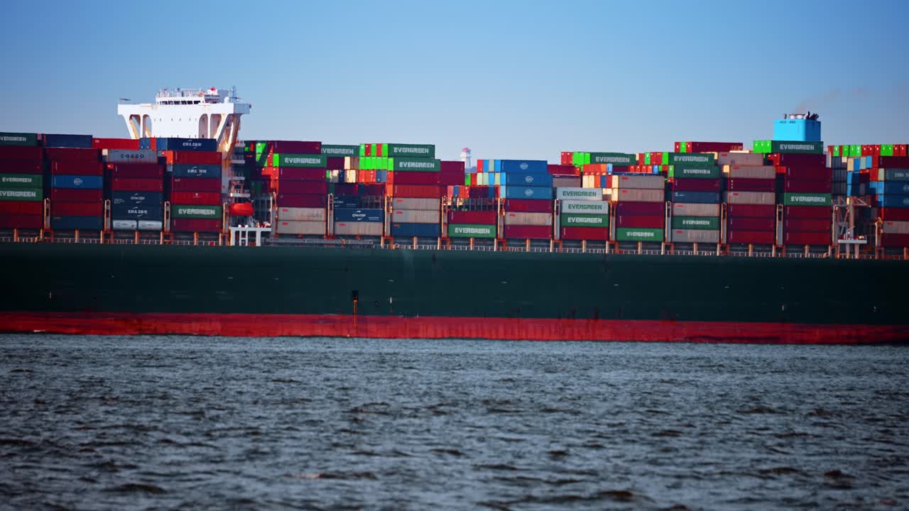 New York, USA, 24 December 2025: Container stacks on cargo ship deck. Colorful shipping containers stacked on deck of ocean going cargo vessel