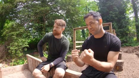 fit men relaxing over obstacle course 4k