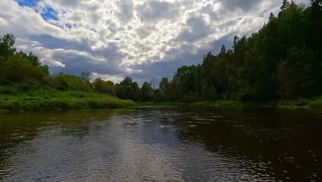 Murky-skyline-over-Gauja-national-park,-beautiful-riparian-forest-overgrown,-Latvian-forestry