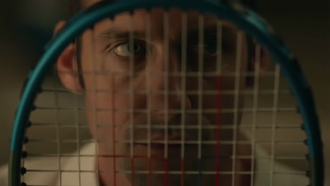man with tennis racket