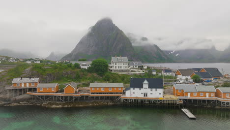 famous reine fishing village with iconic wooden houses on stilts, lofoten