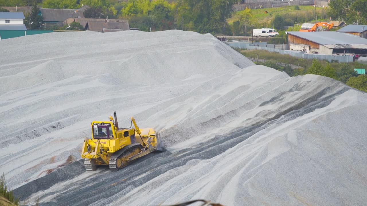 Bulldozer working in a gravel quarry