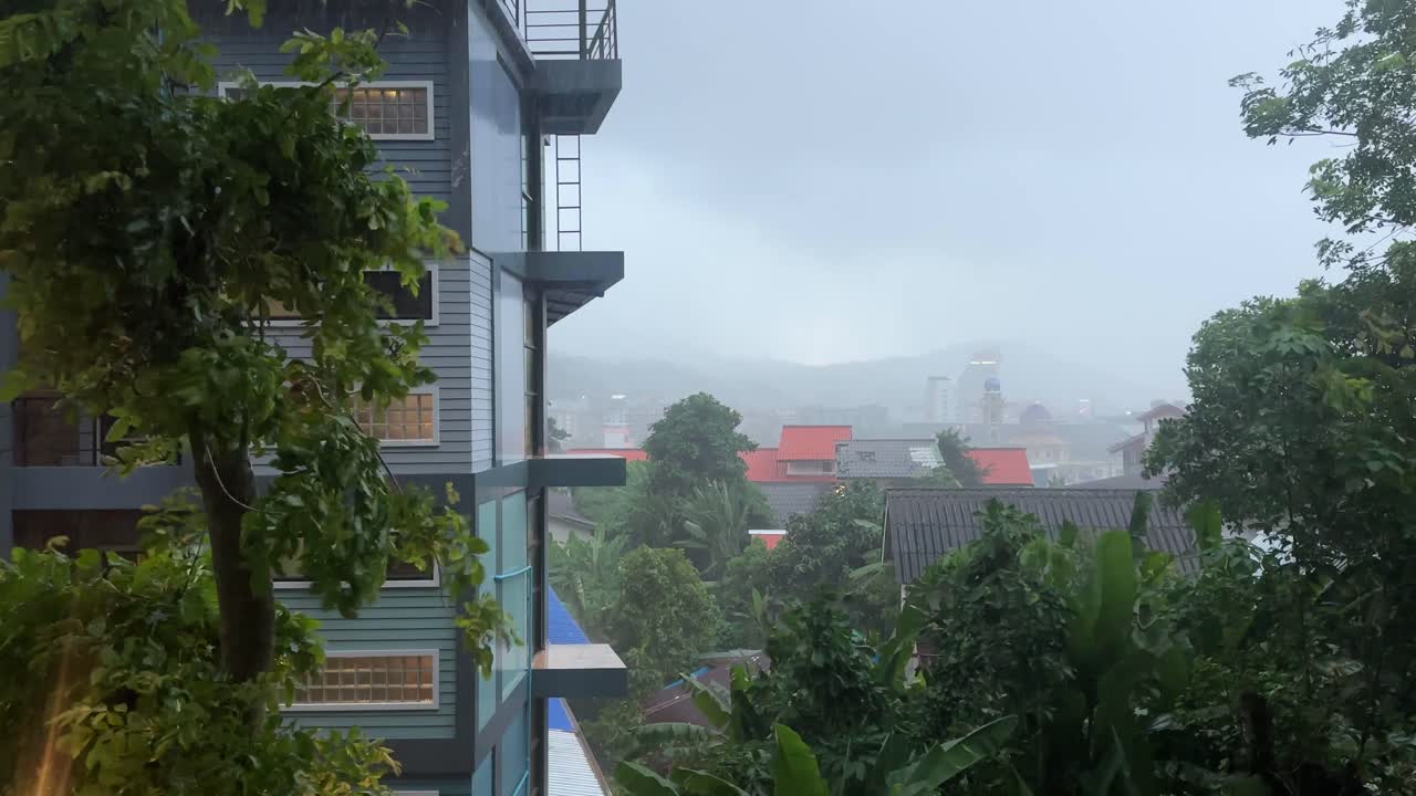 Rainstorm hitting phuket thailand patong beach town windy raining
