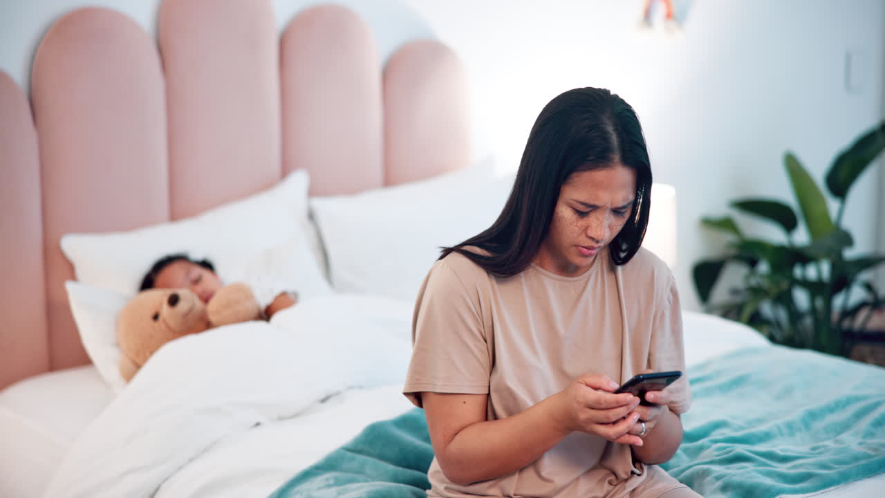 Sick child in bed, mother and phone for advice
