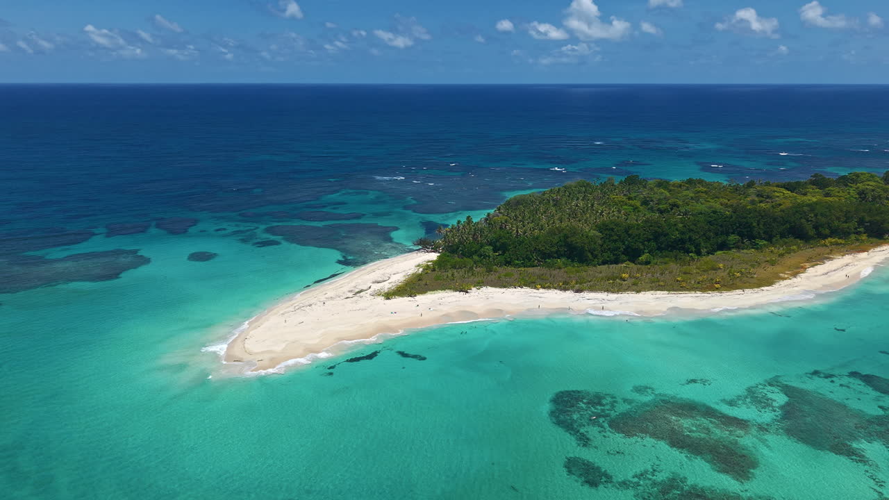 Aerial View Of Island With Tropical Palm Trees Surrounded By Clear Water In Bocas del Toro, Panama.
