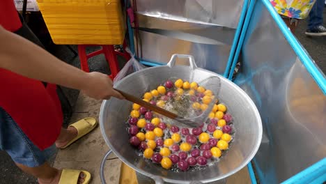 watch as vibrant snacks are fried a bustling local market showcasing culinary art