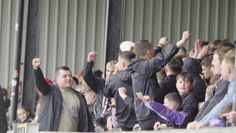 in unison, chanting they all respond, roaring force, a mighty bond