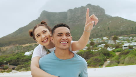 Love,-pointing-and-smile-with-couple-at-beach