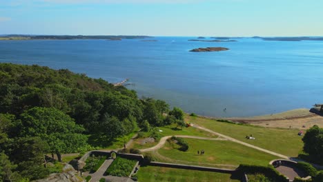 people visit the beautiful kungsbacka fjord in halland, sweden on a sunny summer day. aerial drone