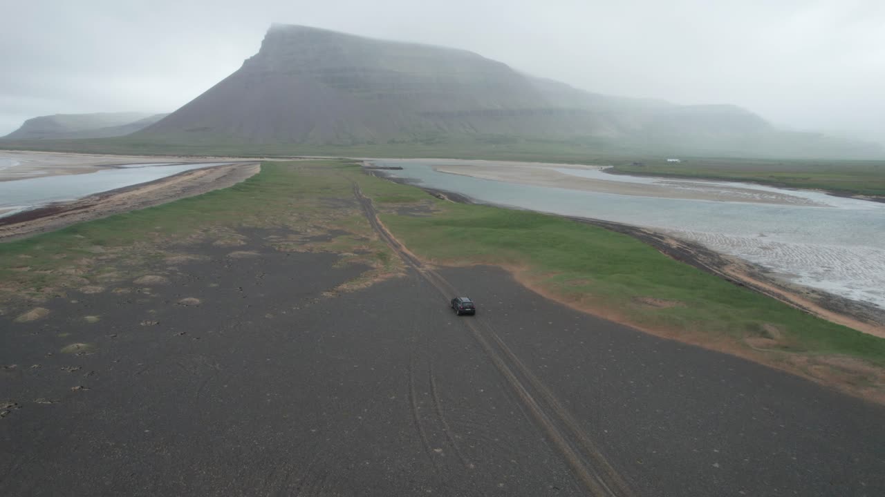 Icelandic Coastal Adventure: Driving on a Black Sand Beach