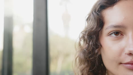 relaxing at home, woman with curly hair enjoying peaceful moment, copy space