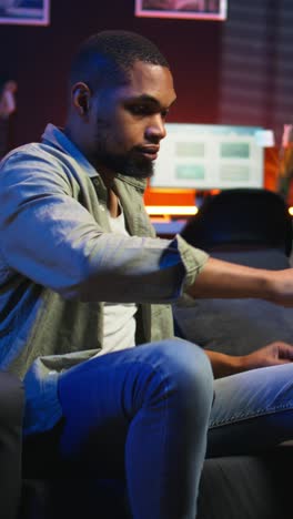 vertical video african american freelancer participates at a web class course on laptop