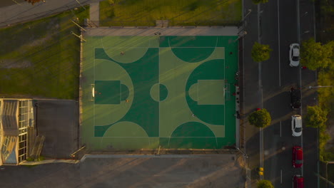 students warming up on suburban basketball court