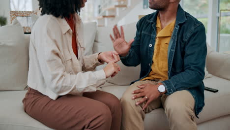 couple having a conversation on the couch