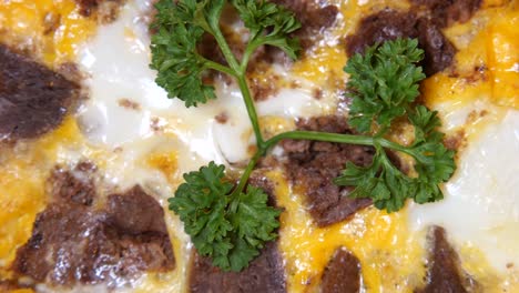 close-up of a delicious and savory baked egg dish with meat