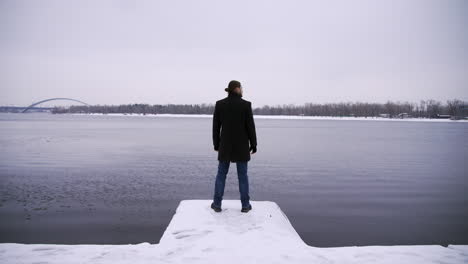 Man-standing-outdoors