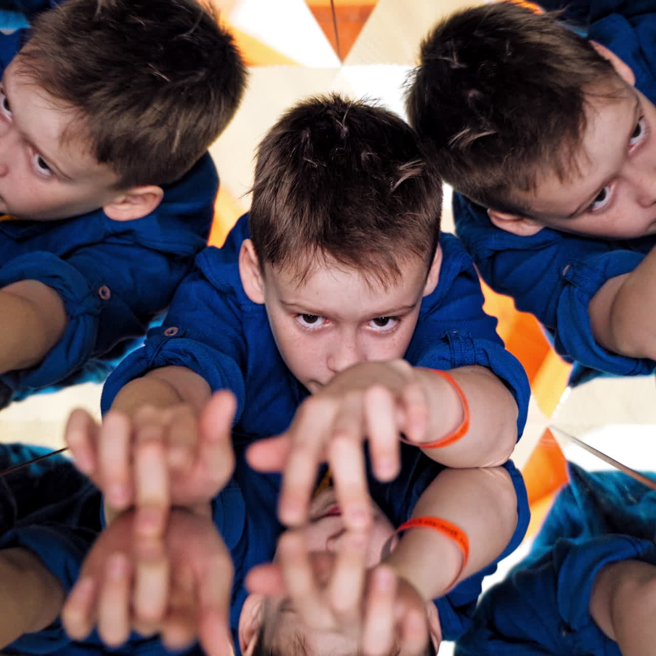 Abstract montage of a beautiful boy. Child in Caleidoscope.