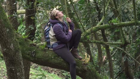 tilt up shot of woman in nature