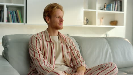 happy man enjoy serene home atmosphere closeup. freelancer resting in pajamas