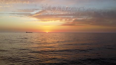 Beautiful-fiery-sun-sinking-in-the-horizon-in-batroun,-Lebanon--Aerial