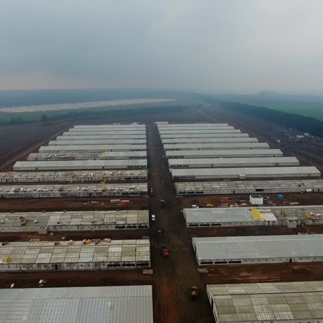 new agricultural farm building. a modern enterprise for workshops and incubators. flying over the animal farm