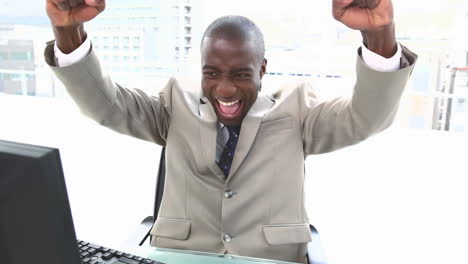 black businessman shouting and raising arms