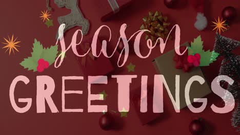 Animation-of-seasons-greetings-text-over-christmas-decorations