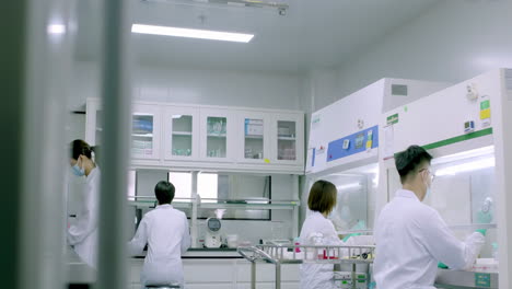 biochemistry sterile laboratory where scientists, technicians in lab coats on cutting-edge research performing a biological experiment, and advanced equipment for analysis