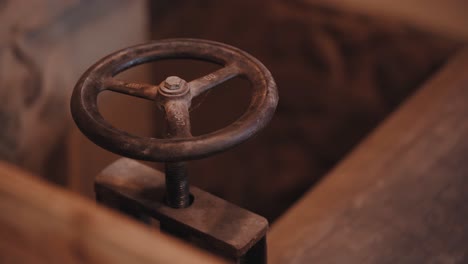 Super-close-up-of-rusty-wheel-of-a-moving-mill