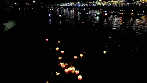 tiny floating lanterns on the serene thu bon river signify "peace, goodwill, and harmony."