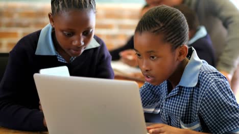 students using laptop in the classroom 4k