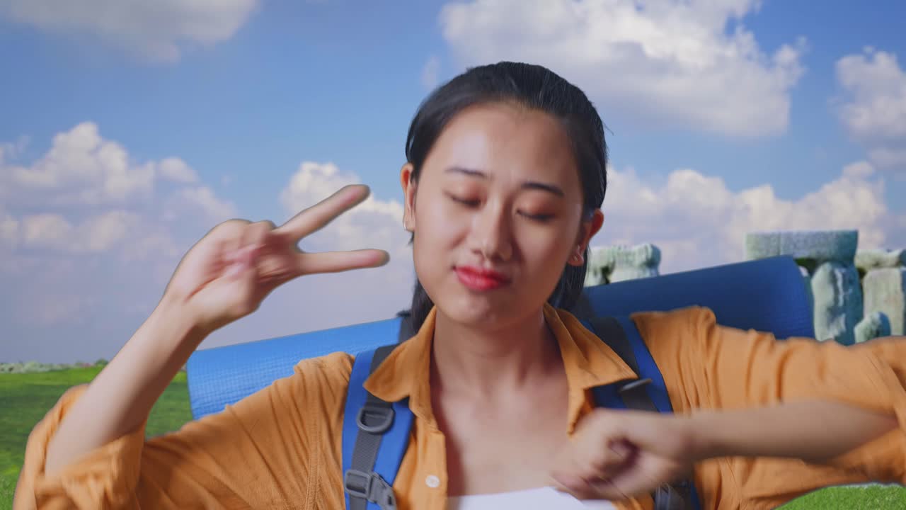 Close Up Of Asian Female Hiker With Mountaineering Backpack Enjoy Dancing While Traveling In Stonehenge