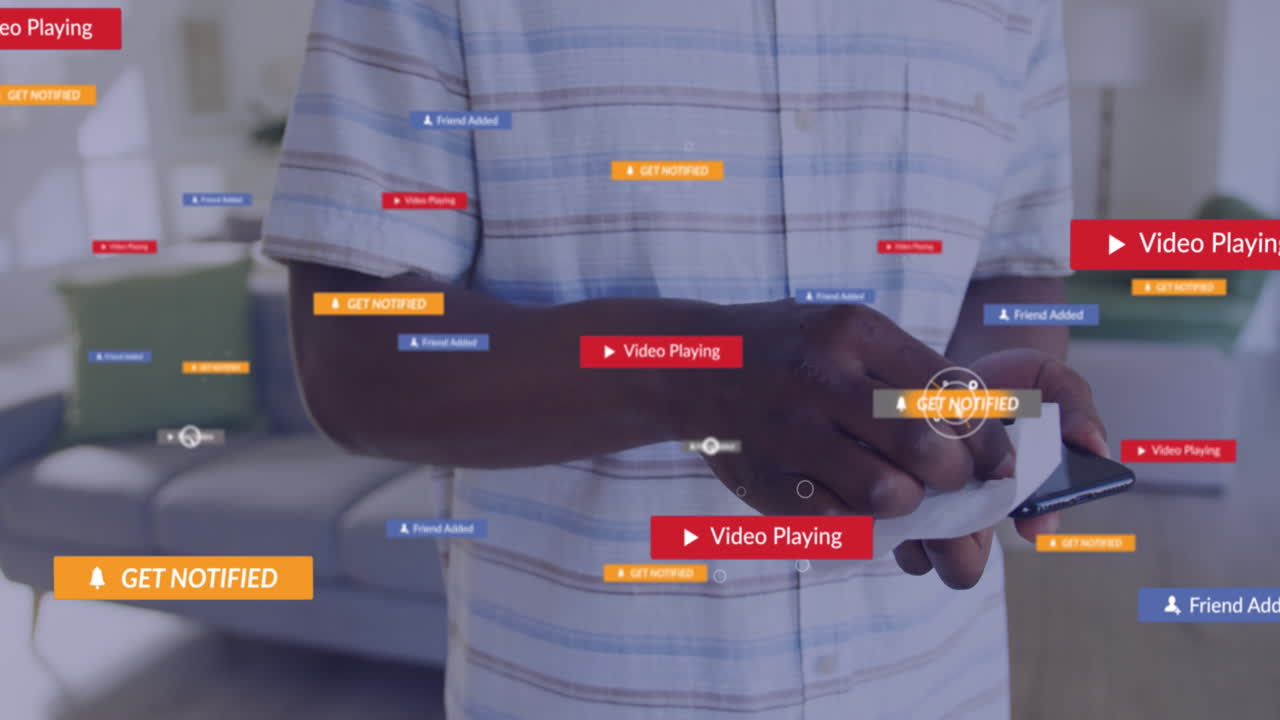 Animation of social media icons with texts over african american man cleaning smartphone