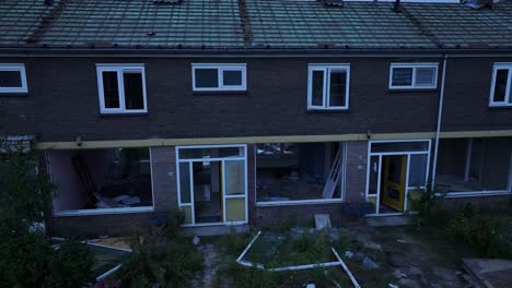 work underway to demolish neighbourhood rundown residential buildings