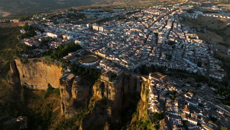 aerial drone view of the compacted cityscape of ronda, a famous spanish historic city in spain, europe