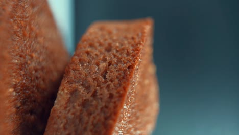 a vertical macro close up shot of tasty cupcakes, on a 360 rotating stand, professional studio lighting, super slow motion, 120 fps, smooth movement, full hd video