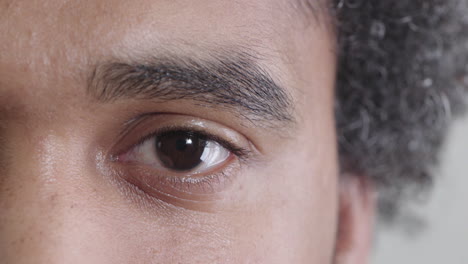 close-up-young-man-opening-eye-looking-at-camera-eyesight-vision