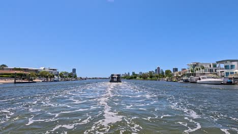 canal view with luxury homes and boats